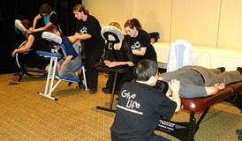Linda Brandie, Carrie Deslippe, Erin Flood and Clem Leung donate chair massage to the participants in the 2010 Dancing with the Local Stars fundraiser